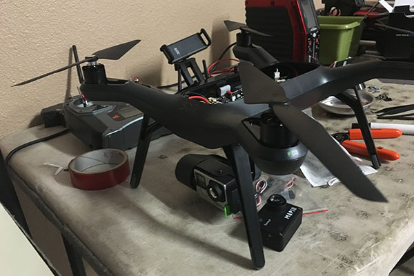 a black drone on a table