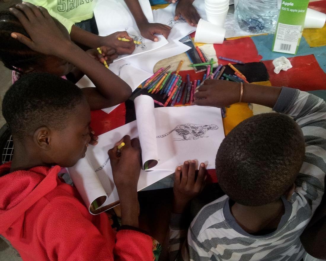 children coloring in activity books